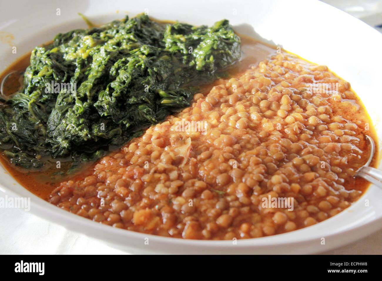 dish with lentils and spinach Stock Photo
