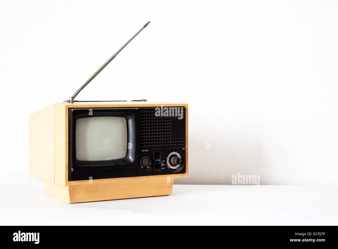 Vintage Yellow TV on white table Stock Photo Alamy