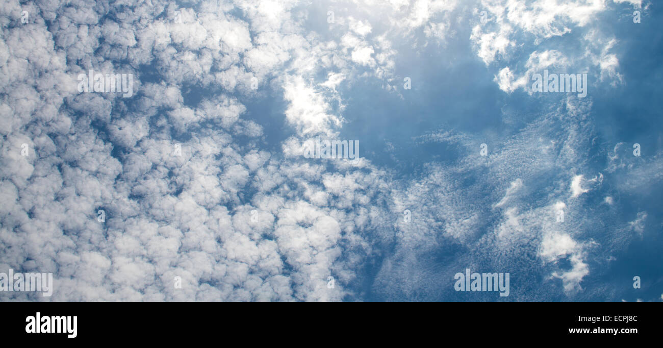 The blue sky and white fluffy clouds Stock Photo - Alamy