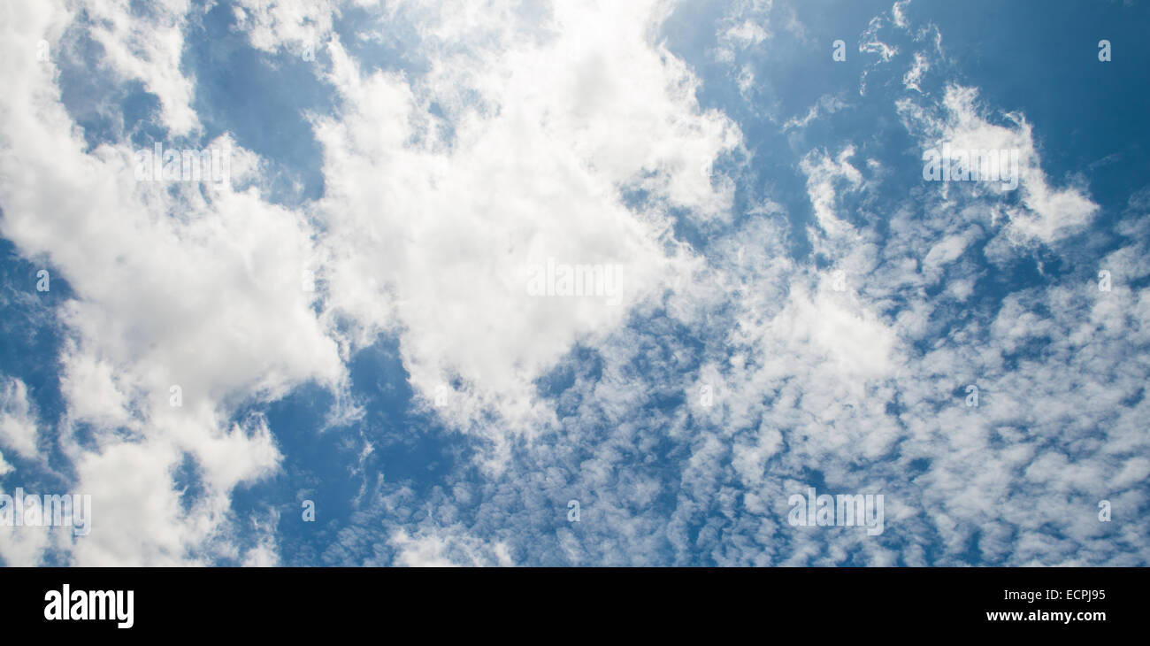 The blue sky and white fluffy clouds Stock Photo - Alamy