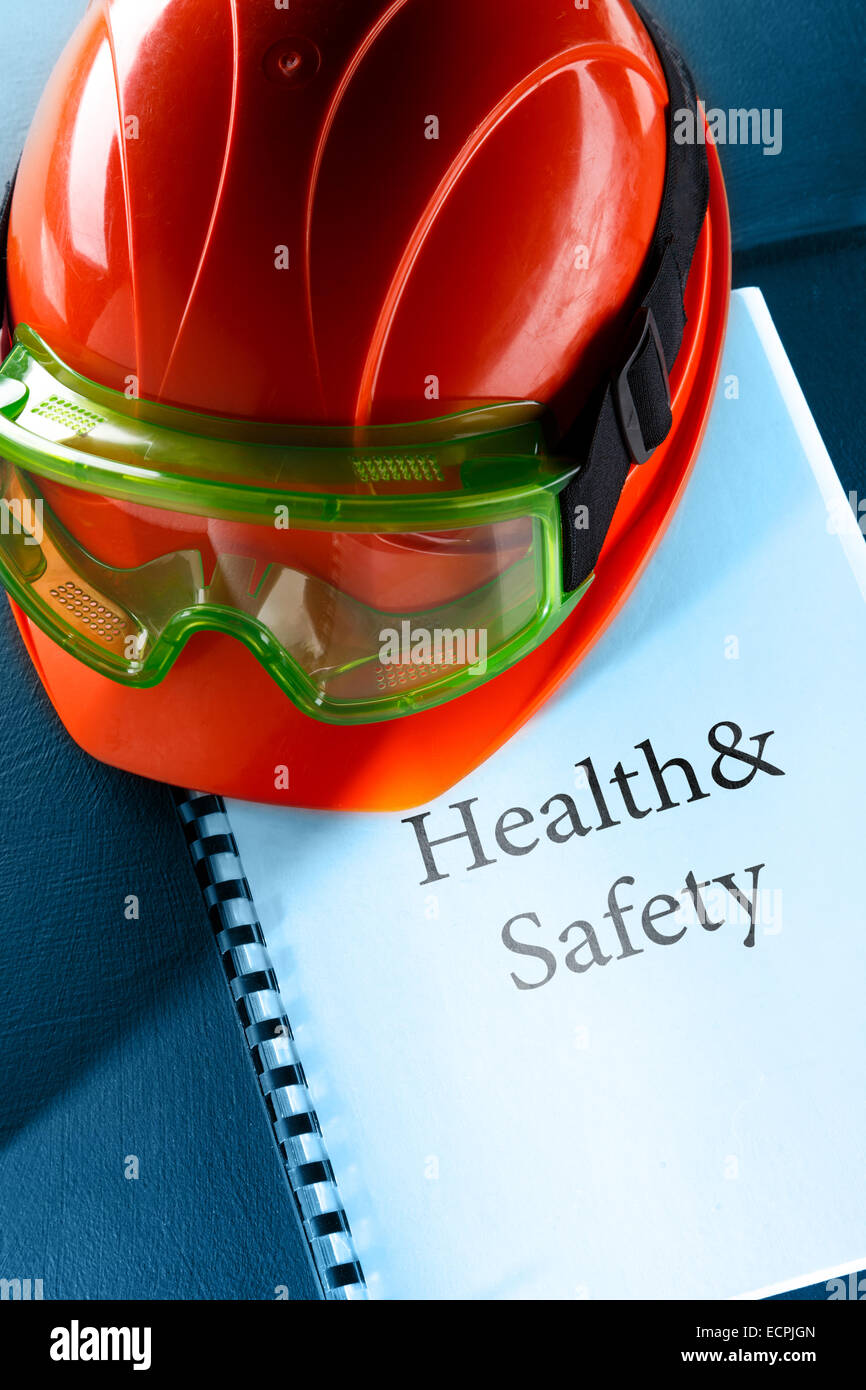 Green goggles and red helmet in closeup Stock Photo