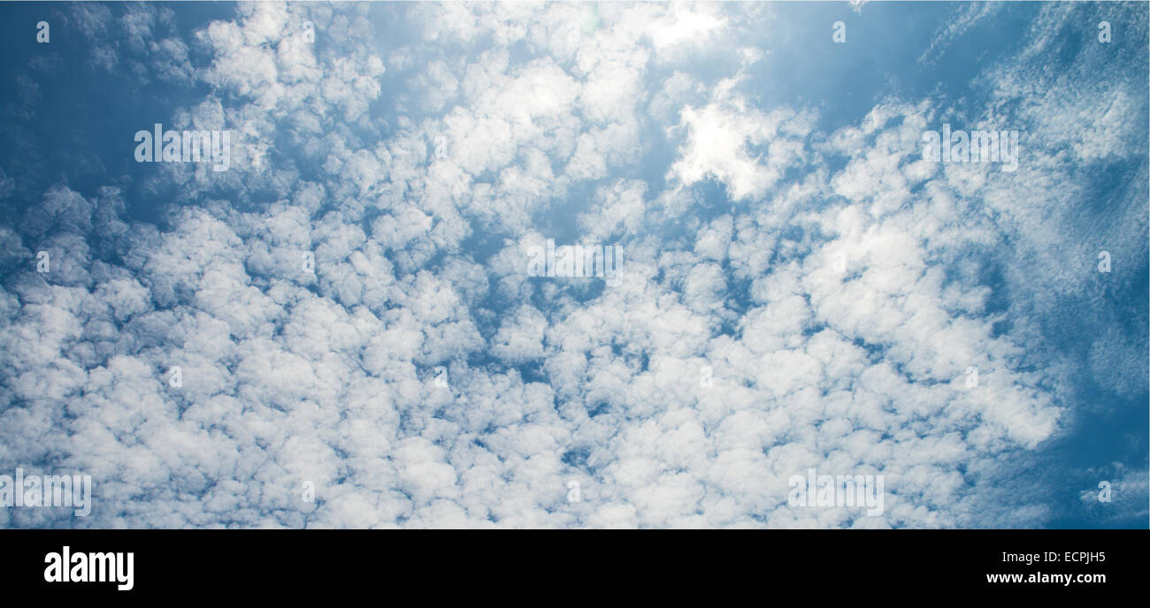 The blue sky and white fluffy clouds Stock Photo - Alamy