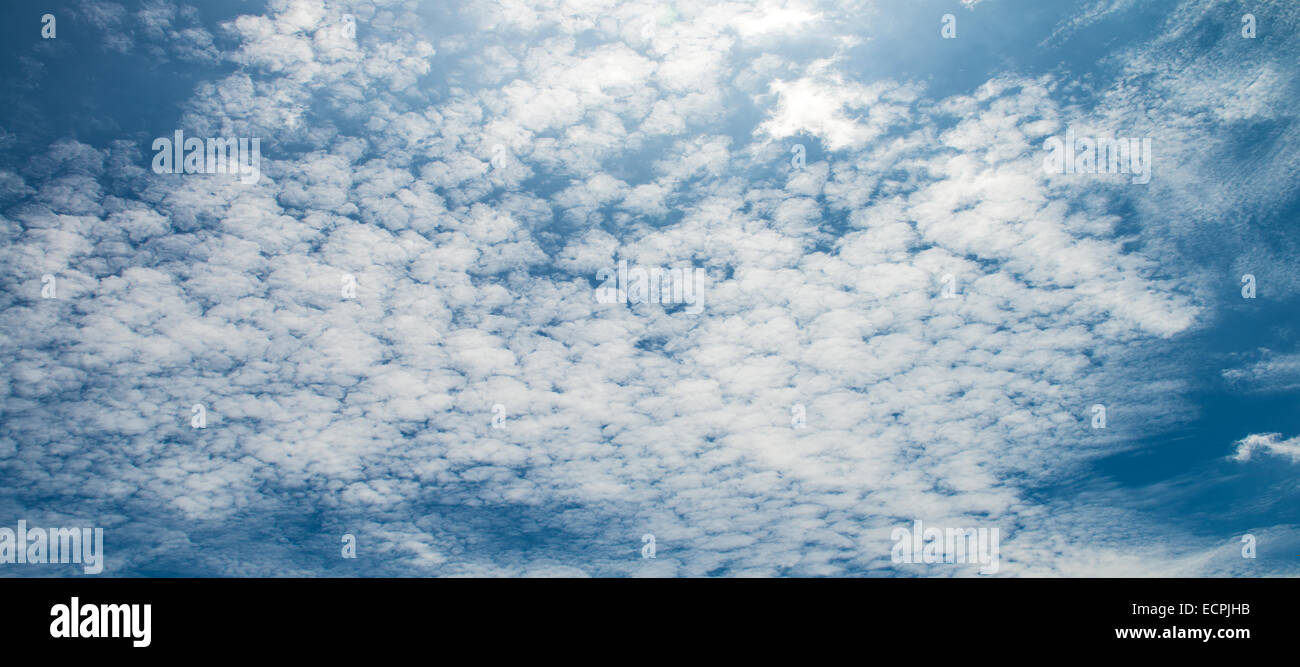 The blue sky and white fluffy clouds Stock Photo - Alamy
