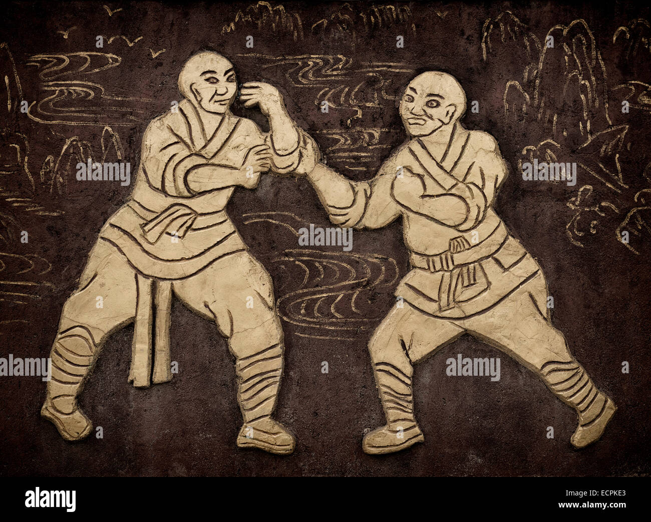 License available at MaximImages.com - Monks practicing Kung Fu artwork on a wall near Shaolin Temple in DengFeng, Henan, China Stock Photo
