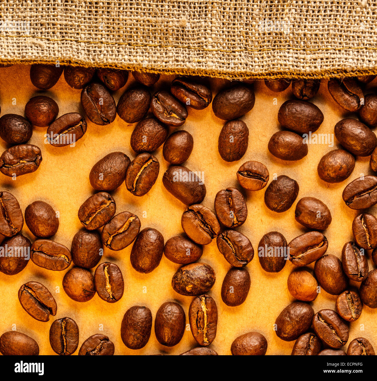 Brown coffee beans with sack in closeup Stock Photo - Alamy