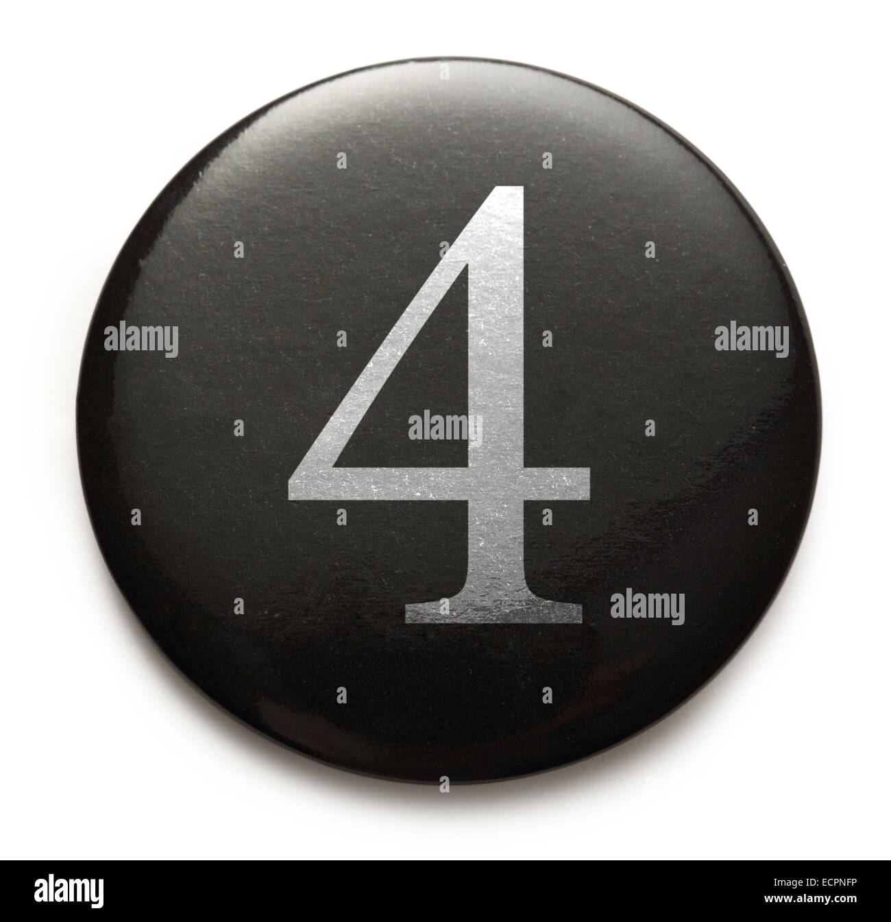 White number 4 on black round badge Stock Photo