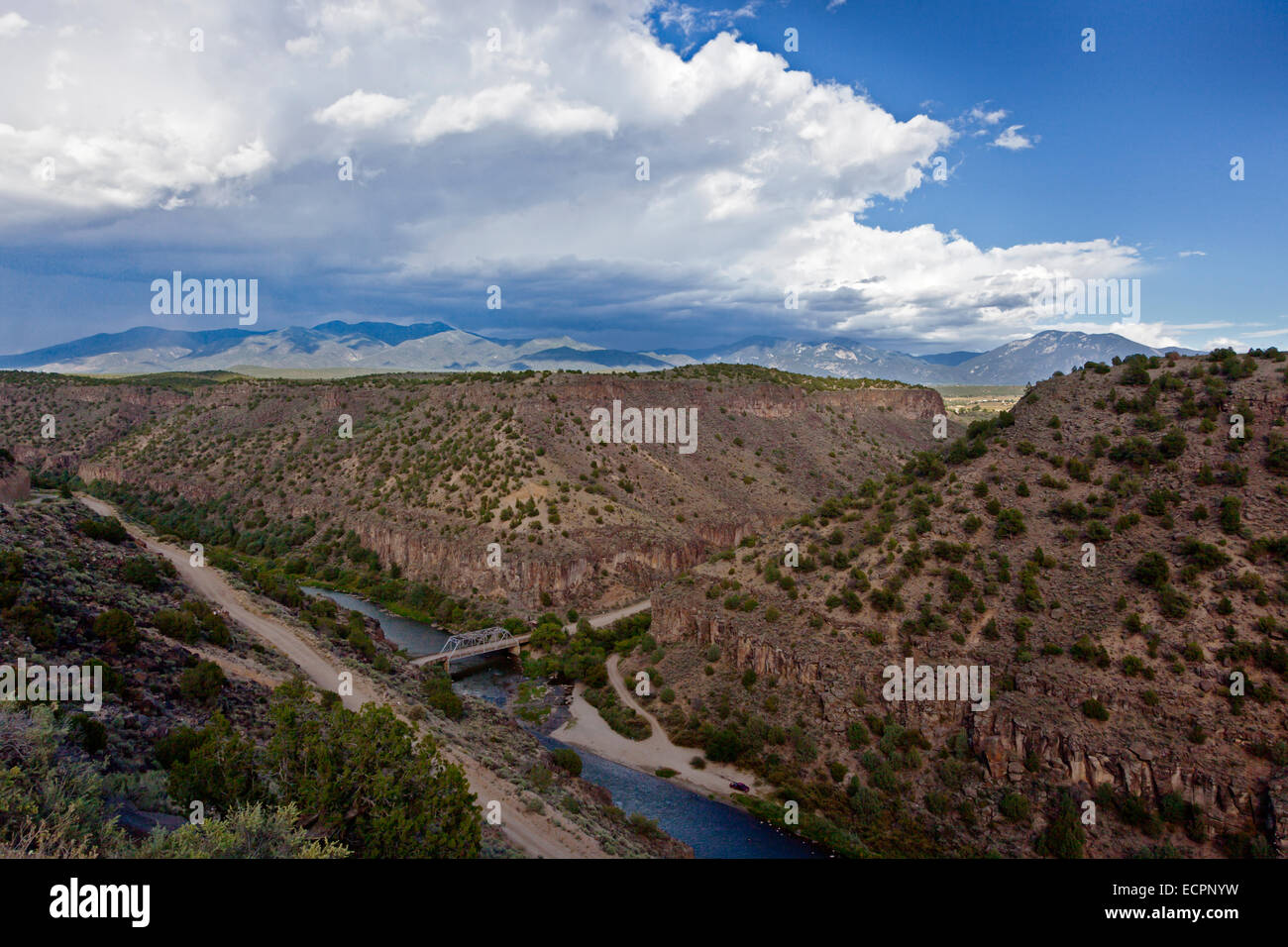 The RIO GRANDE RIVER runs through the TAOS GORGE under the JOHN DUNN BRIDGE- NEW MEXICO Stock Photo