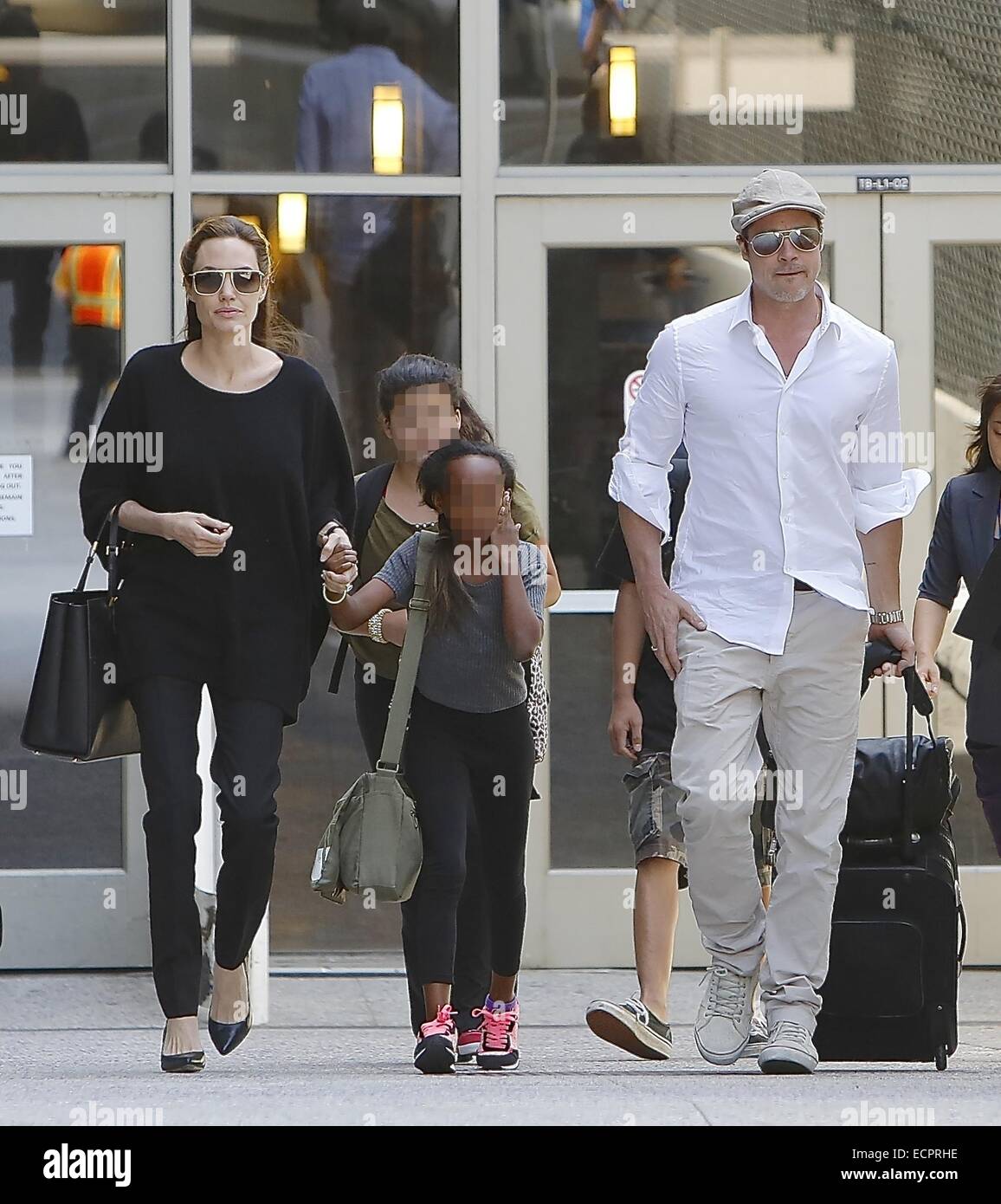Angelina Jolie and her son Maddox Jolie-Pitt arriving at LAX, wearing  leather leggings and carrying a Louis Vuitton bag Featuring: Angelina Jolie,Maddox  Jolie-Pitt Where: Los Angeles, California, United States When: 13 Apr