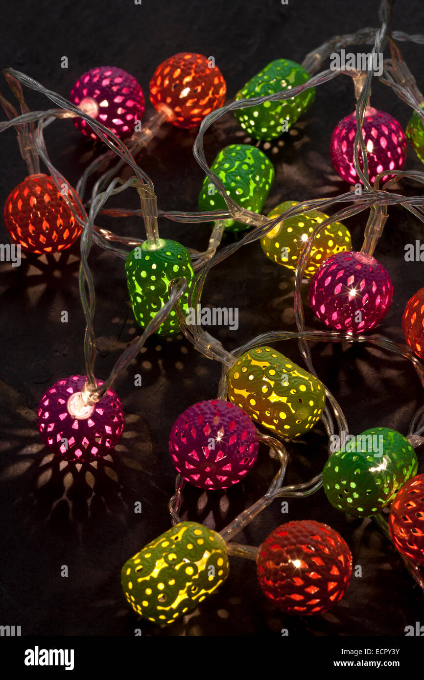 Christmas lights. Multicoloured lanterns made in India, with LED bulbs inside. Stock Photo