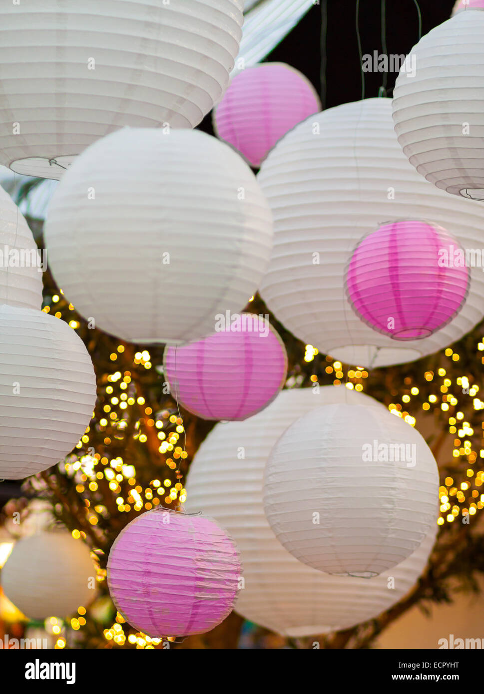 White And Pink Light Balls Hanging On A Ceiling With
