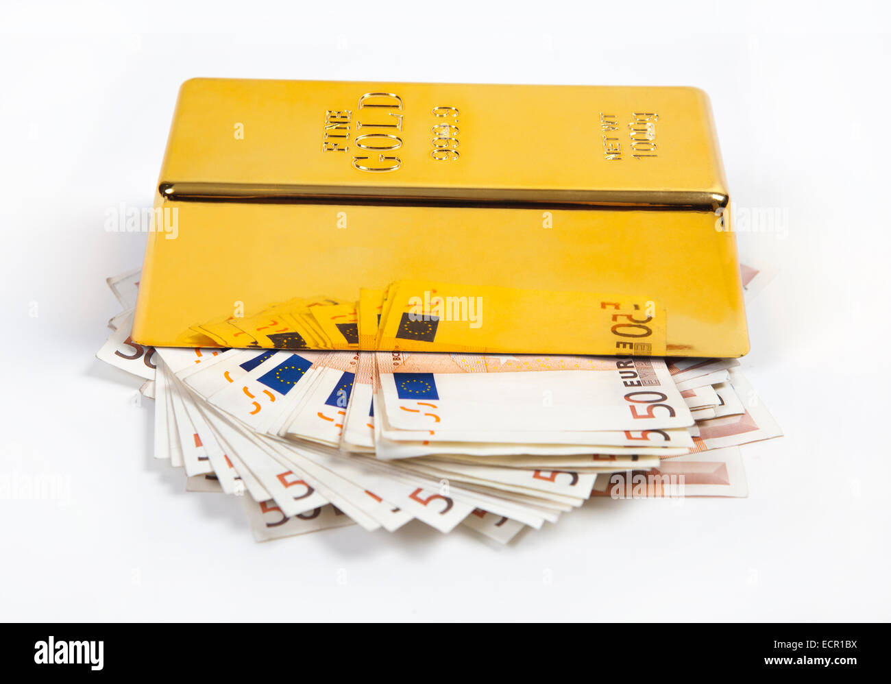Gold bullion lies on a stack euro money seem Stock Photo - Alamy