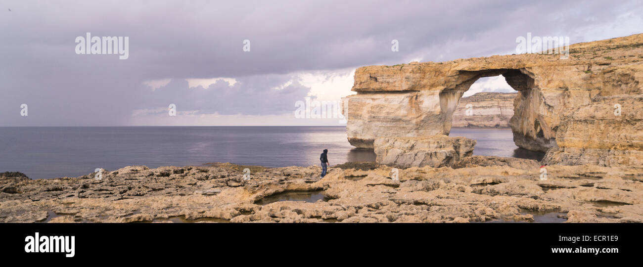 Tourists at the Azure Window on Gozo Island Stock Photo