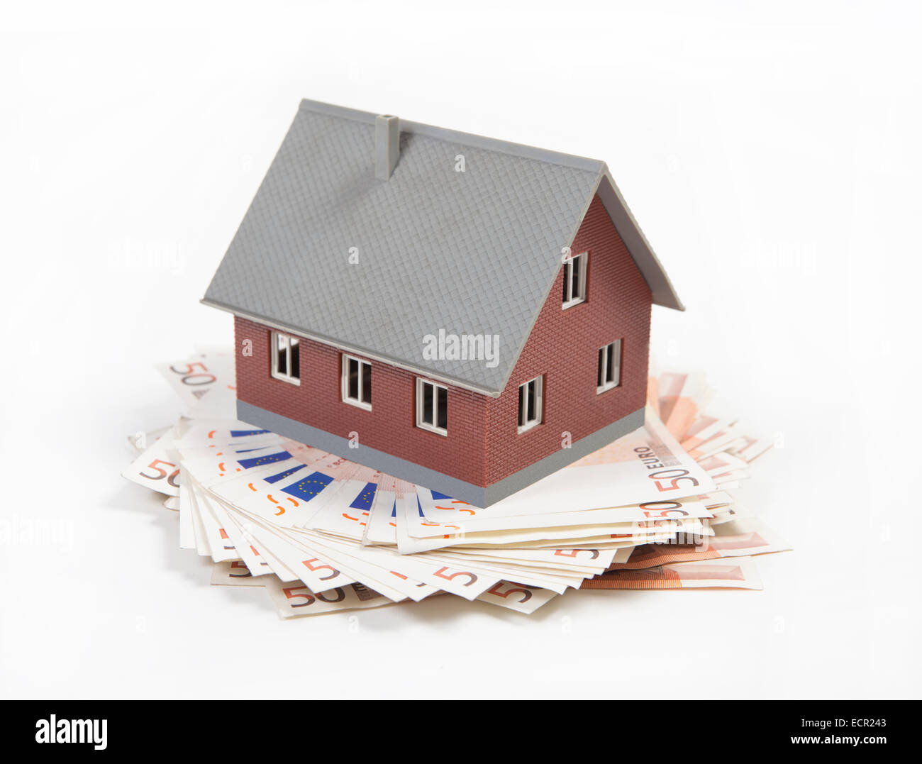 house appear as an retirement provisions on a stack of euro Stock Photo
