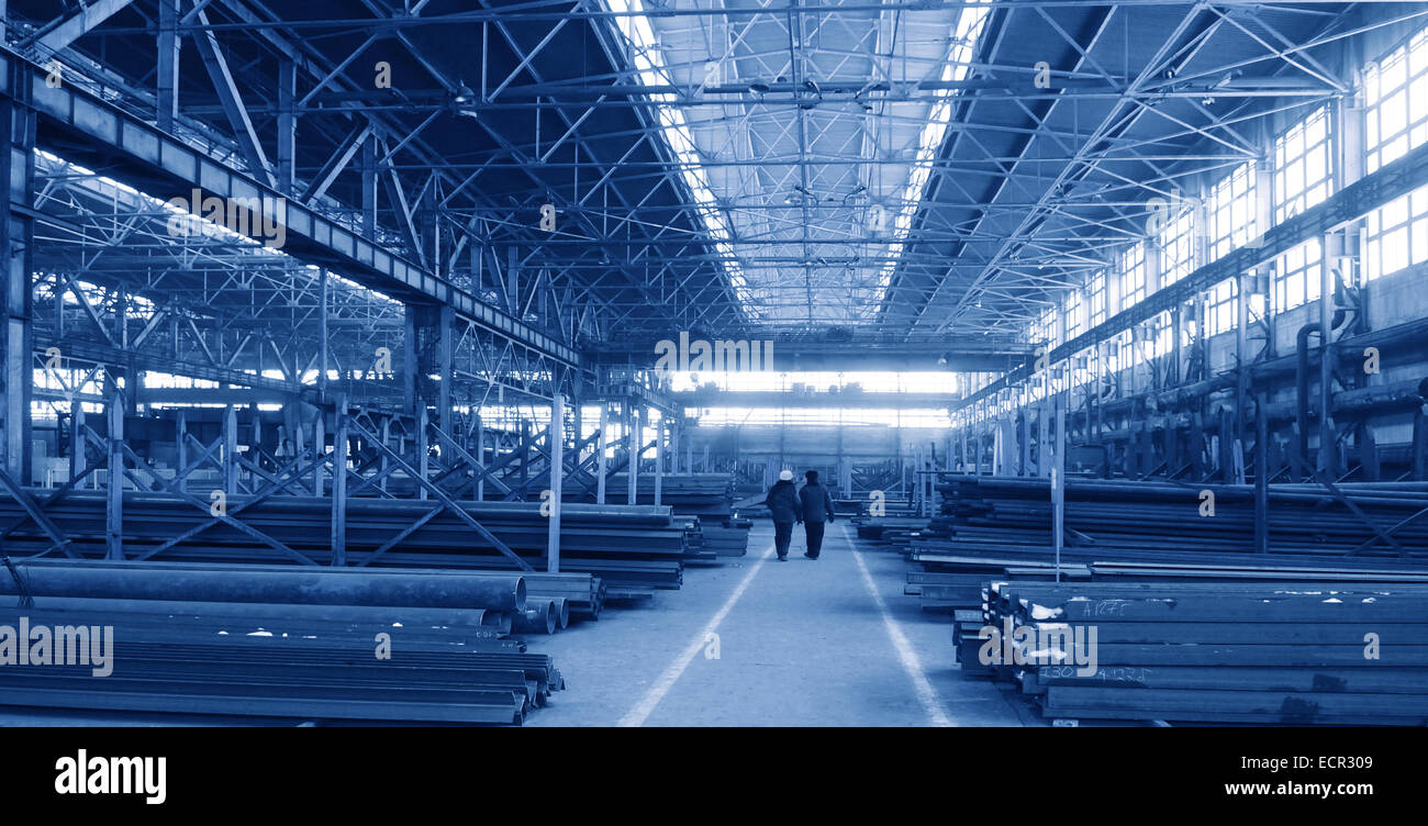 Rambling shop floor is made as steel construction. This production department make a specialty out of metalworks manufacturing. Stock Photo