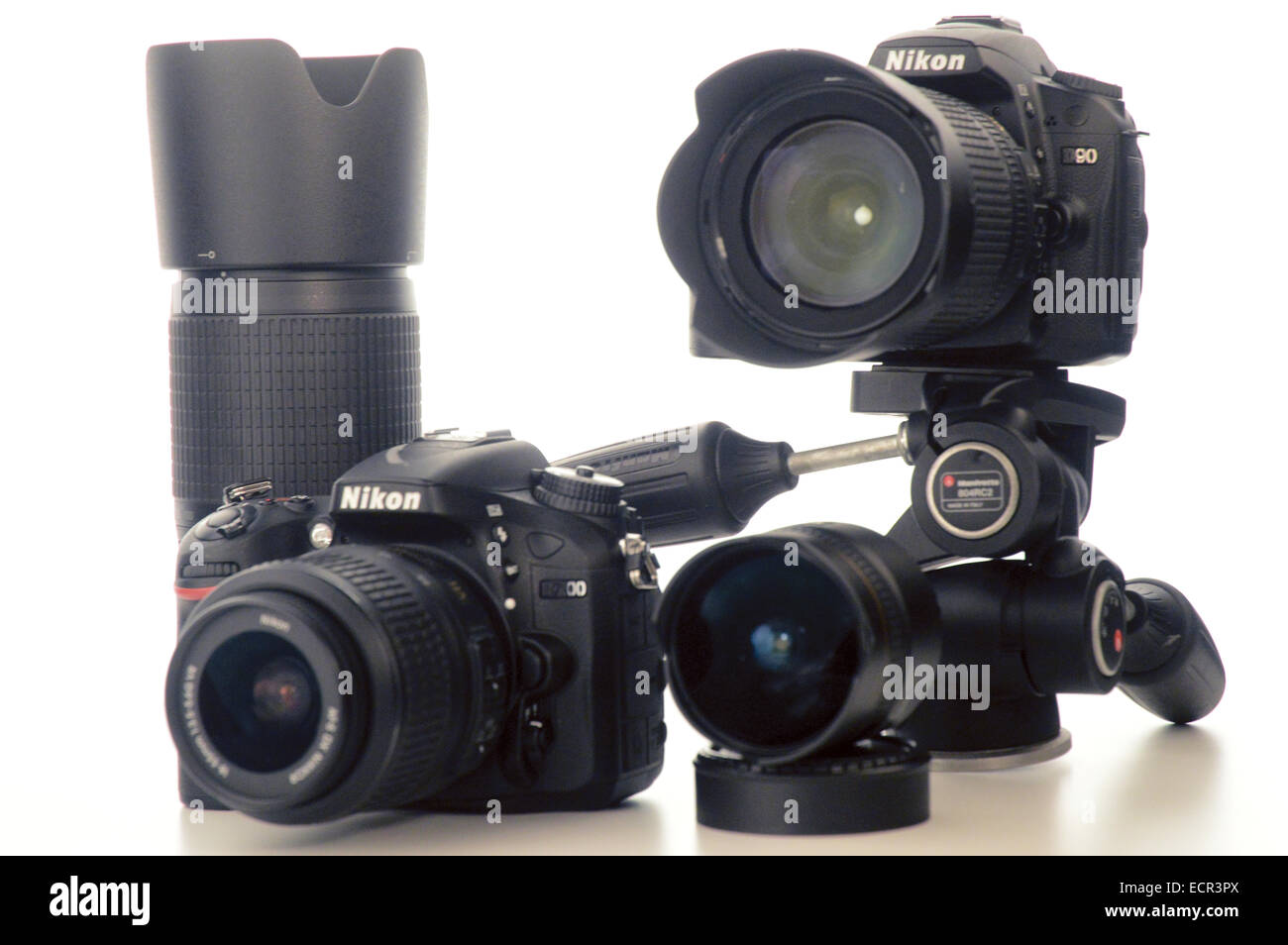 Cameras Nikon D90, Nikon d7000, lenses on white background Stock Photo