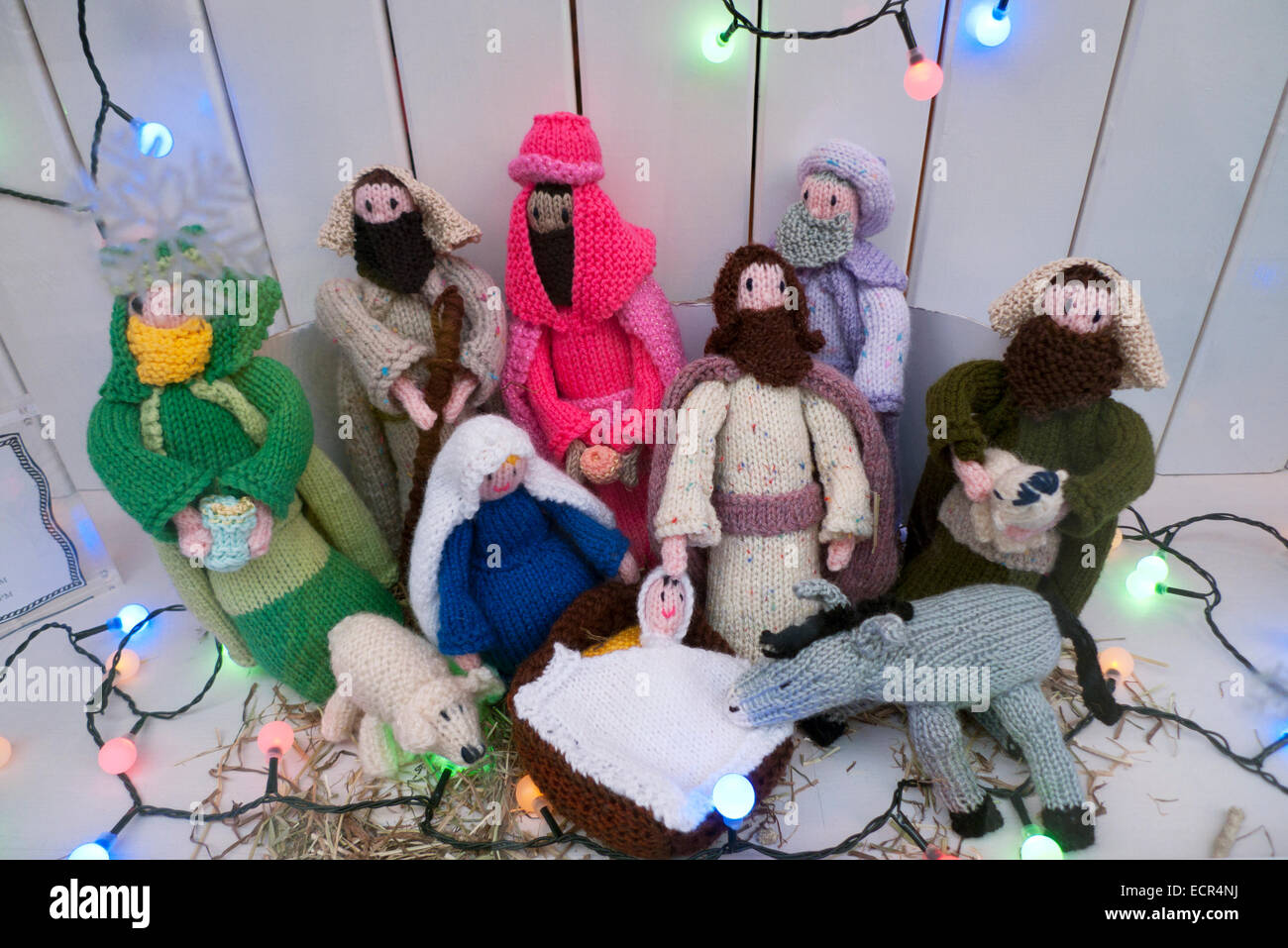Knitted Nativity figures and baby Jesus in a manger at Christmas in