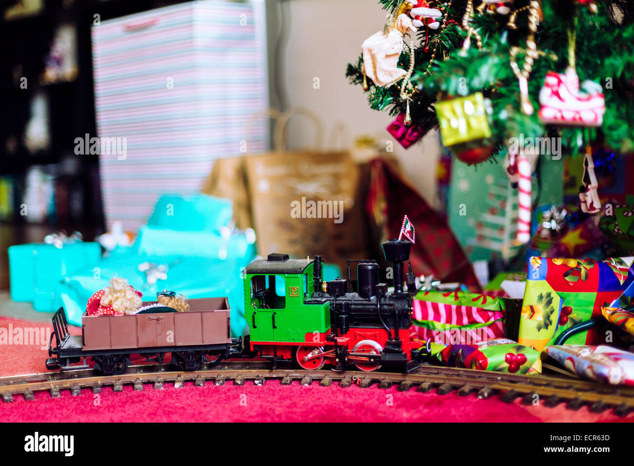 Model train with Christmas presents and tree Stock Photo