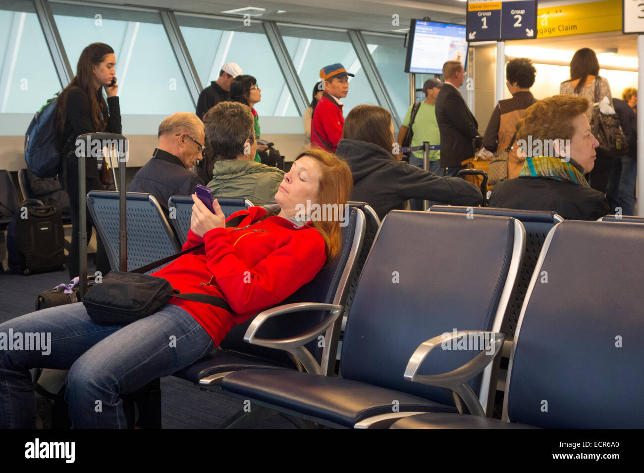 passengers waiting in JFK airport terminal Stock Photo