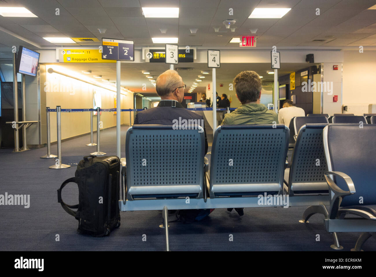 passengers waiting in JFK airport terminal Stock Photo