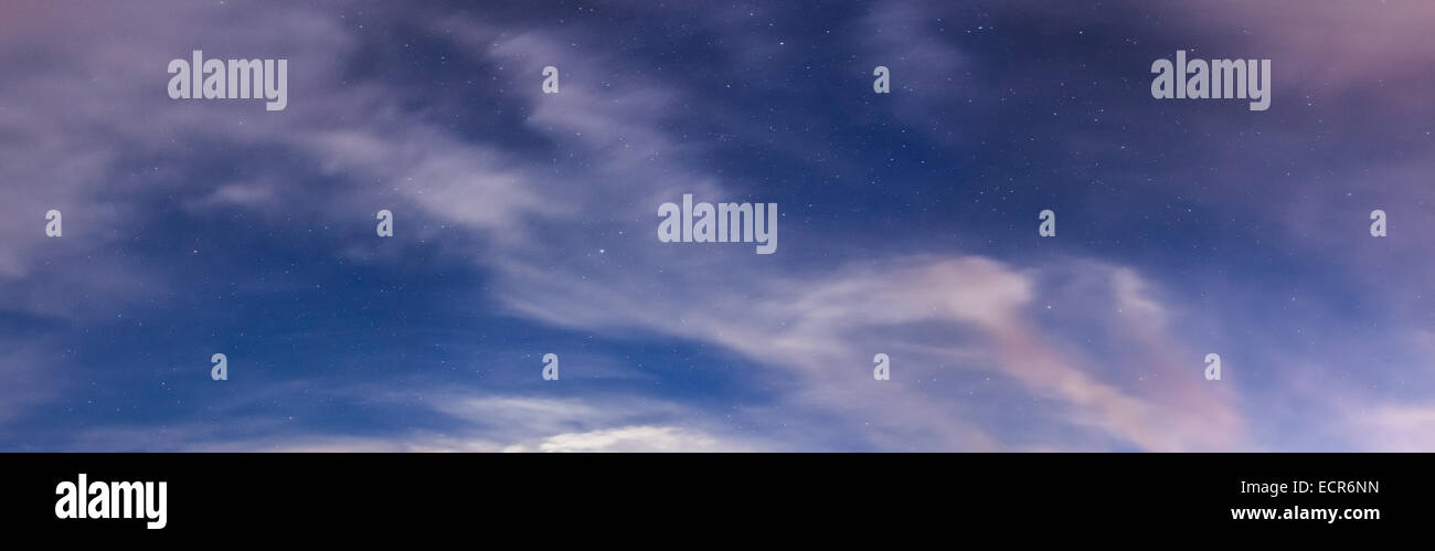 Starry sky and clouds illuminated by moonlight panorama Stock Photo - Alamy