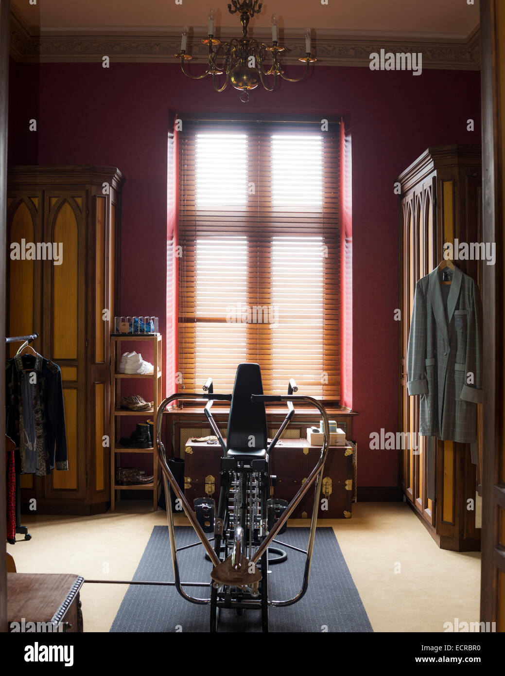 Rowing machine in dressing room with high ceilings Stock Photo