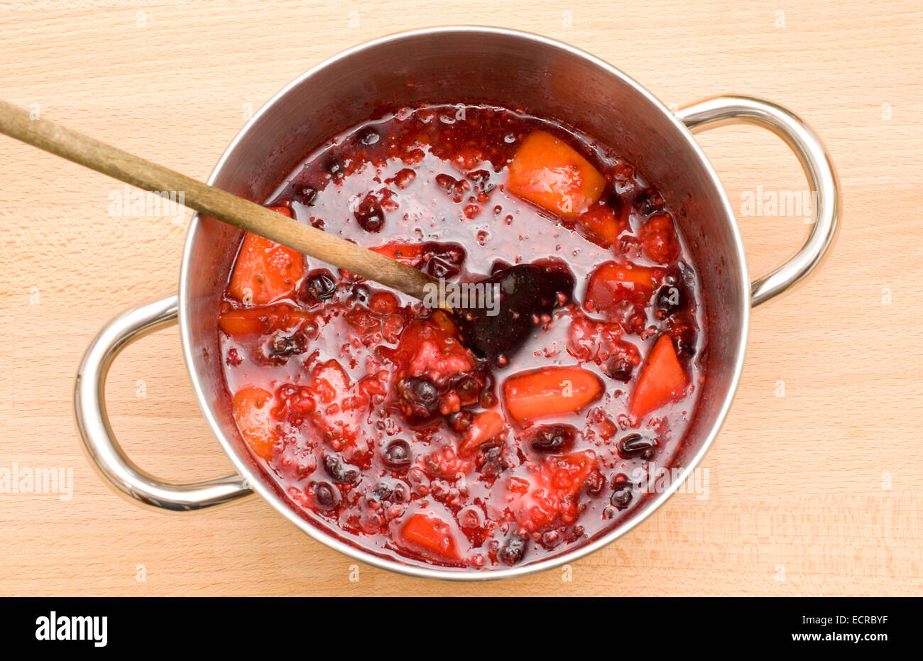 A pot of boiling fruit being reduced in readiness for jam making plus