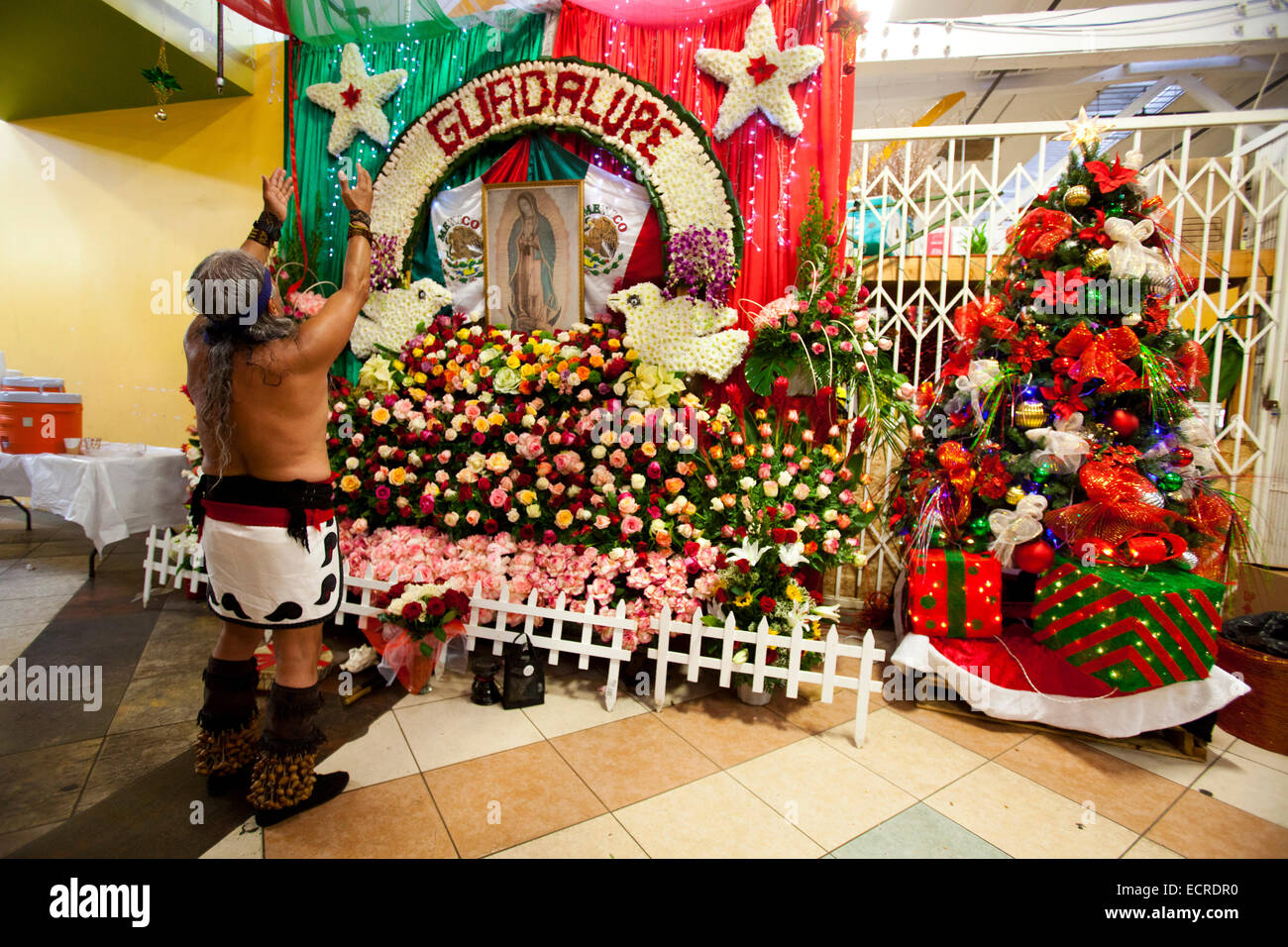Aztec dancers bless the Flower vendors in the Flower Mart, downtown Los