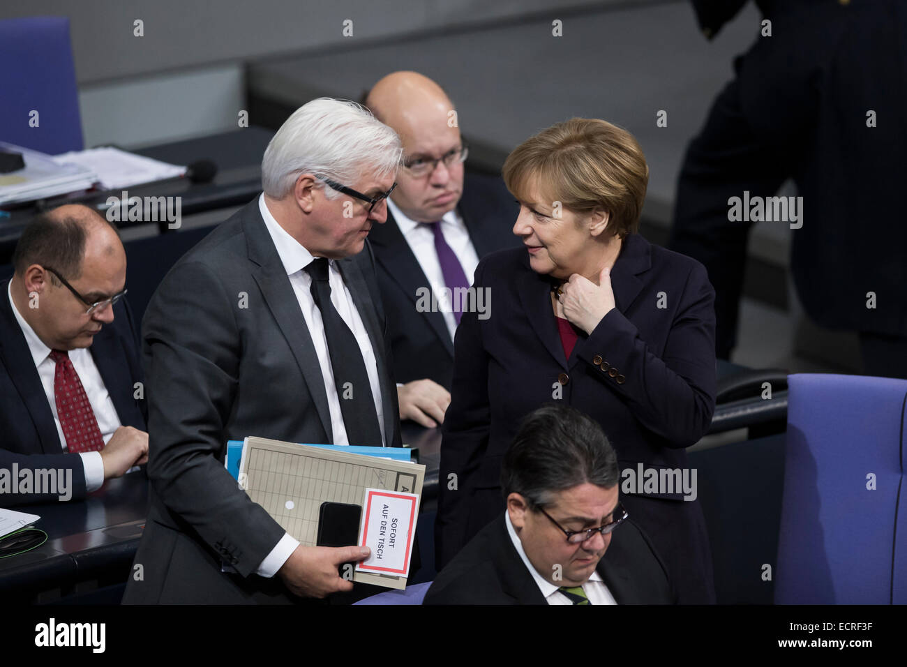 Berlin, Germany. 18th Dec, 2014. Delivery of a governmental declaration by the German Chancellor Angela Merkel  -to the forthcoming European council on the 18th and 19th December in Brussels 2014 at the Bundestag on December 18, 2014 in Berlin, Germany. Picture: talk between Frank-Walter Steinmeier (SPD), German Foreign Minister, and Chancellor Angela Merkel (CDU), Credit:  Reynaldo Chaib Paganelli/Alamy Live News Stock Photo