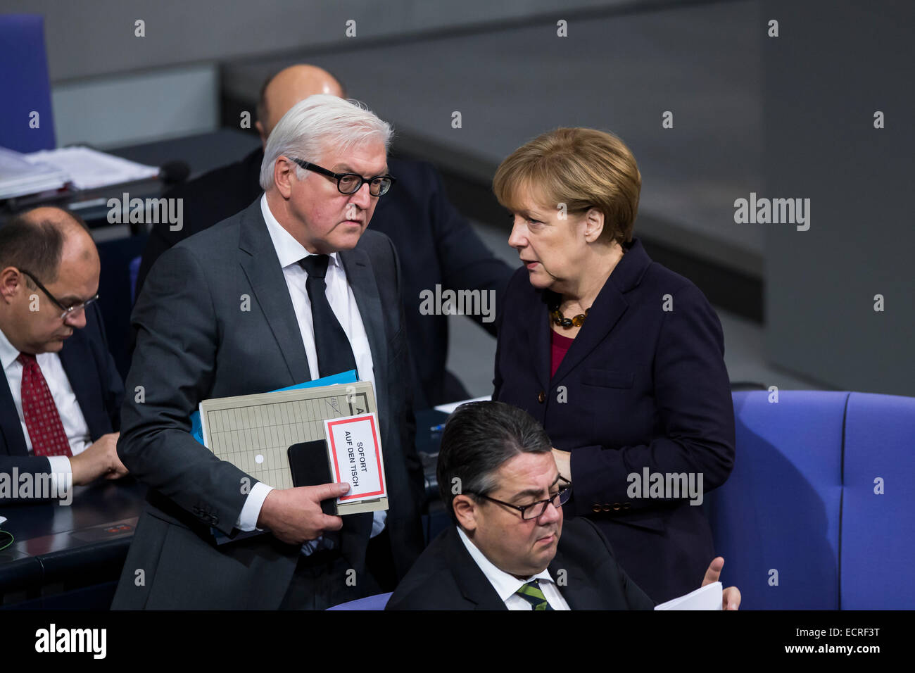 Berlin, Germany. 18th Dec, 2014. Delivery of a governmental declaration by the German Chancellor Angela Merkel  -to the forthcoming European council on the 18th and 19th December in Brussels 2014 at the Bundestag on December 18, 2014 in Berlin, Germany. Picture: talk between Frank-Walter Steinmeier (SPD), German Foreign Minister, and Chancellor Angela Merkel (CDU), Credit:  Reynaldo Chaib Paganelli/Alamy Live News Stock Photo