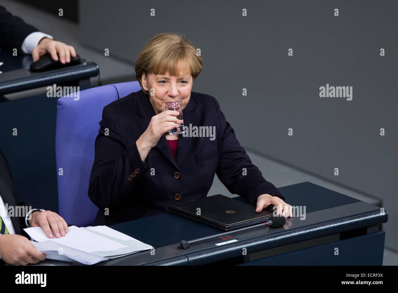 Berlin, Germany. 18th Dec, 2014. Delivery of a governmental declaration by the German Chancellor Angela Merkel  -to the forthcoming European council on the 18th and 19th December in Brussels 2014 at the Bundestag on December 18, 2014 in Berlin, Germany. Picture: Chancellor Angela Merkel (CDU), talking with Sigmar Gabriel (SPD), German Minister of Economy and Energy, at the Bundestag. Credit:  Reynaldo Chaib Paganelli/Alamy Live News Stock Photo