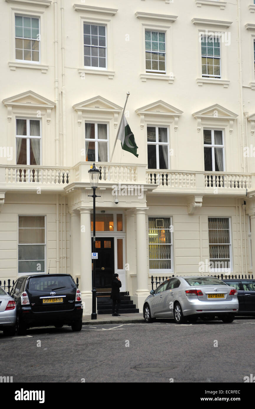 London, UK, 18 December 2014, The Pakistan Embassy in London flies its flag at half-mast in the 3 days of mourning following the Peshawar school massacre. Credit:  JOHNNY ARMSTEAD/Alamy Live News Stock Photo