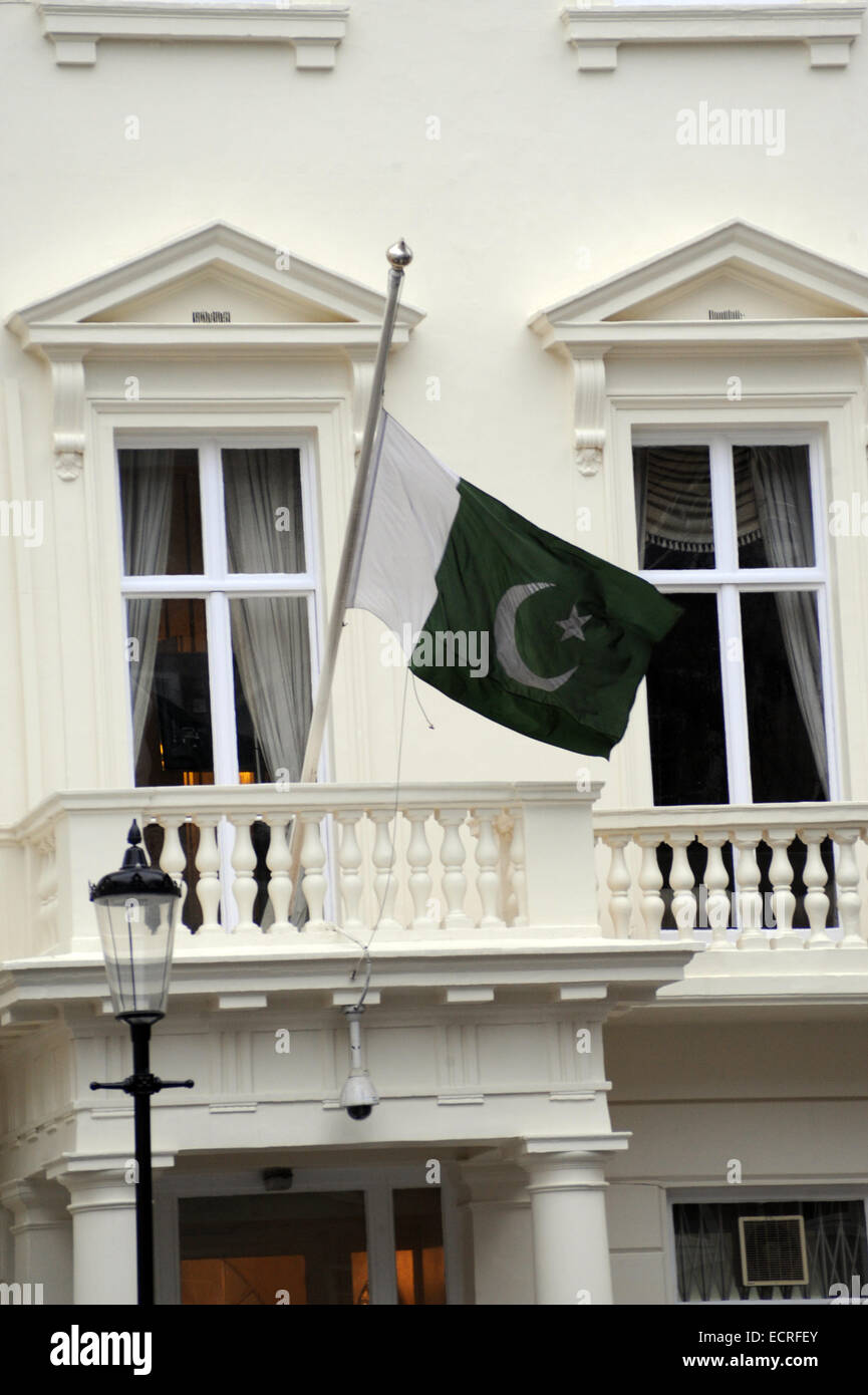 London, UK, 18 December 2014, The Pakistan Embassy in London flies its flag at half-mast in the 3 days of mourning following the Peshawar school massacre. Credit:  JOHNNY ARMSTEAD/Alamy Live News Stock Photo