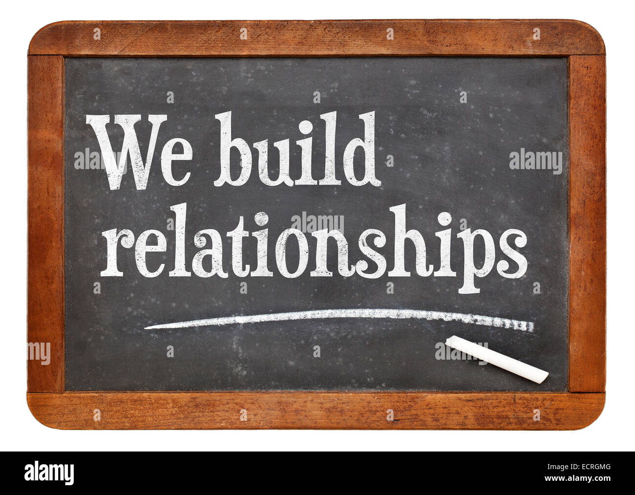 We build relationships - white chalk text on a vintage slate blackboard Stock Photo