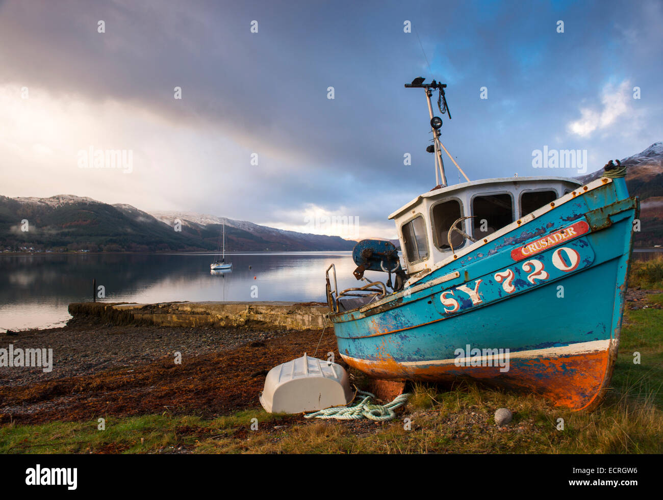 A boat on the beach at Invershiel on the banks of Loch Duich in the Highlands of Scotland, UK Stock Photo