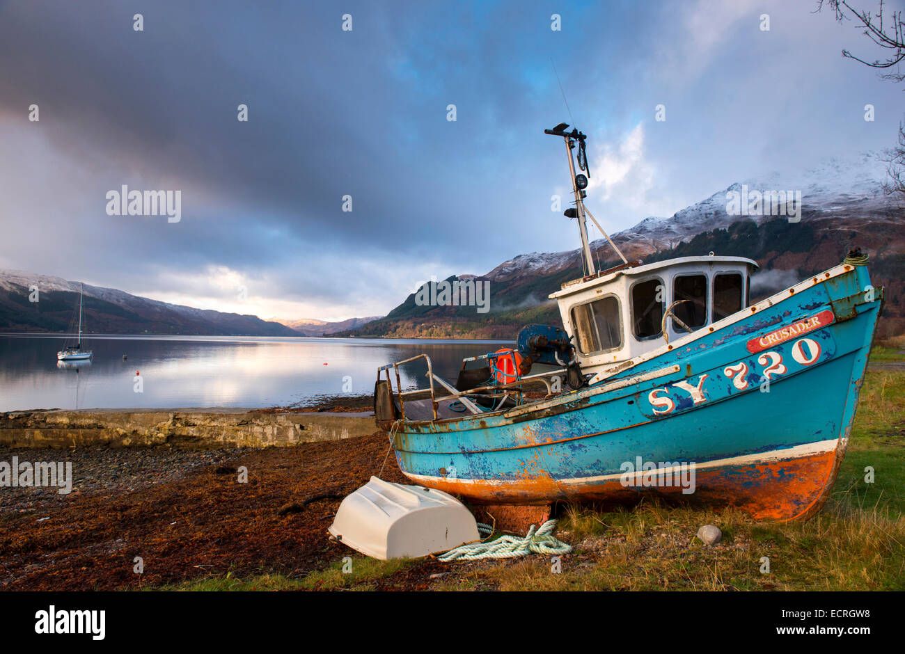 A boat on the beach at Invershiel on the banks of Loch Duich in the Highlands of Scotland, UK Stock Photo