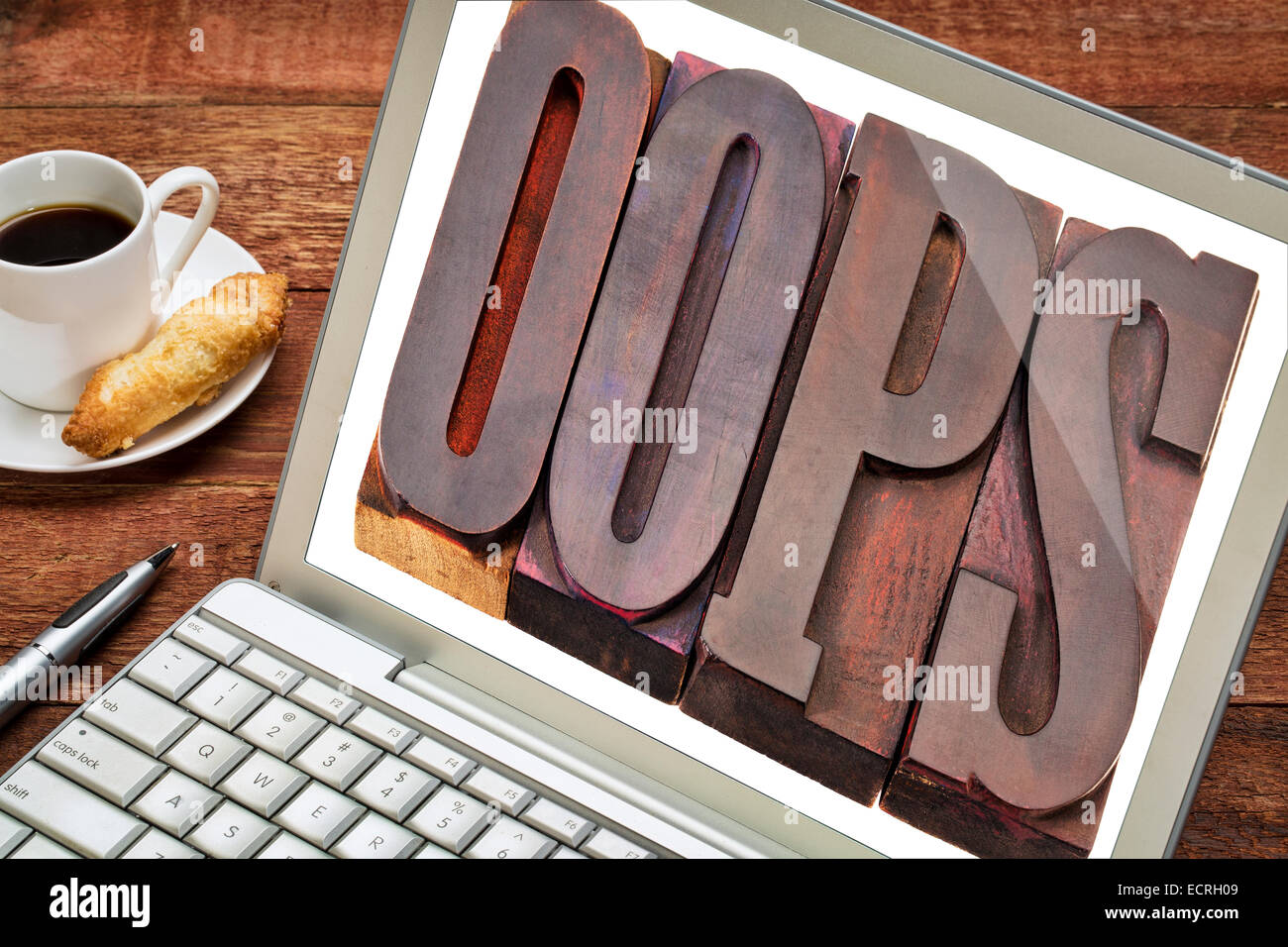 internet concept - oops exclamation word in vintage wooden letterpress printing blocks on laptop screen Stock Photo