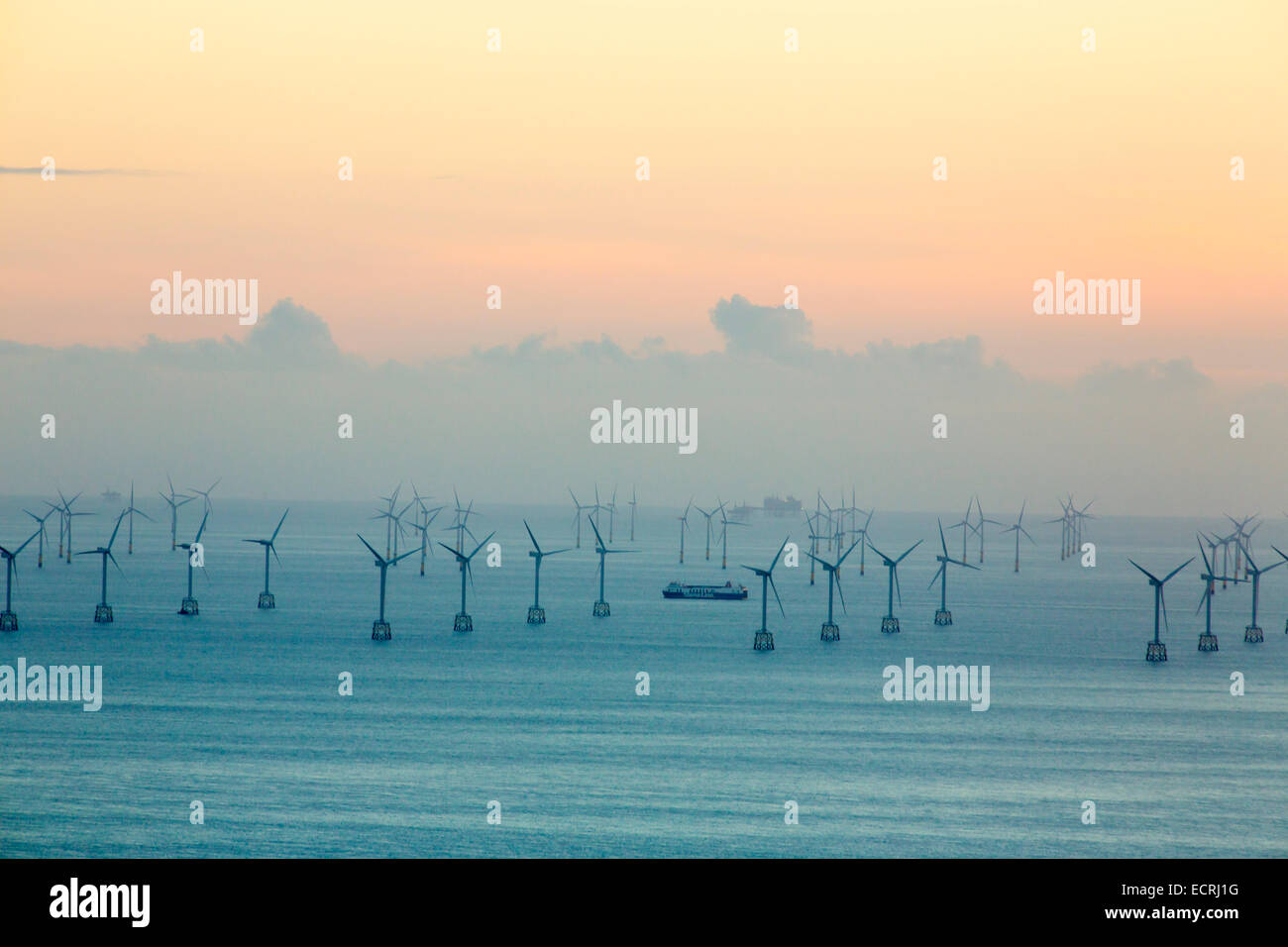 The Walney offshore wind farm and gas drilling rigs in Morecambe Bay, from Black Combe, Cumbria, UK. Stock Photo