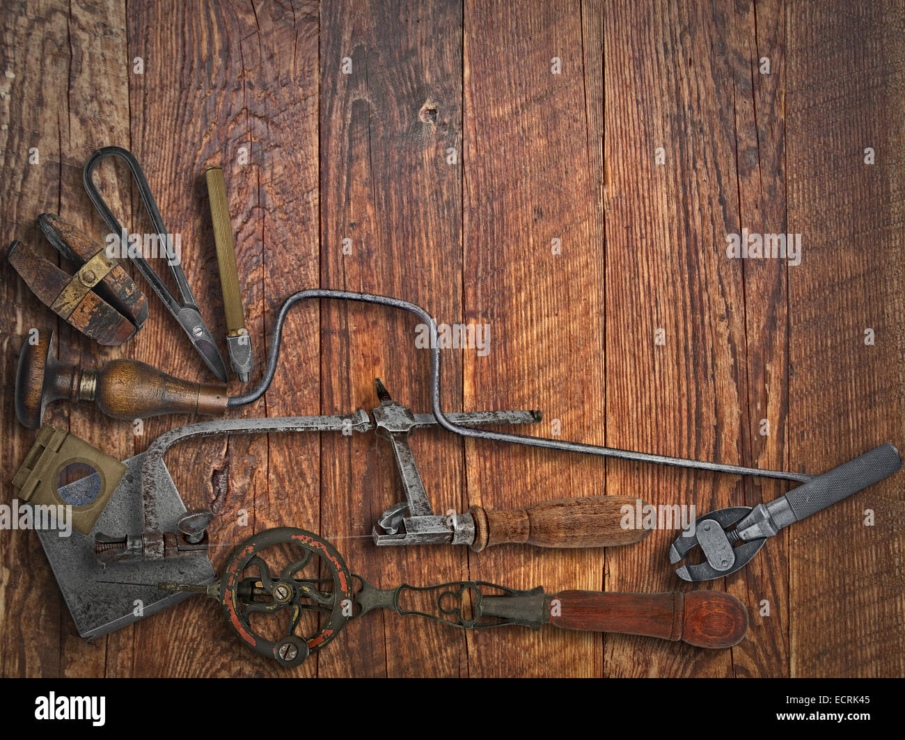 vintage jeweler tools over wooden working bench, space for text Stock