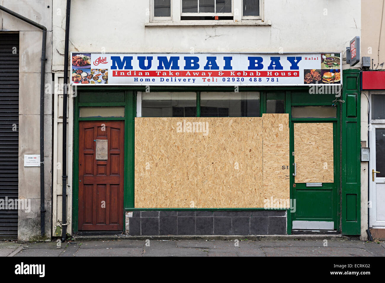 Boarded up closed Indian take away shop gone out of business, Cardiff, Wales, UK Stock Photo