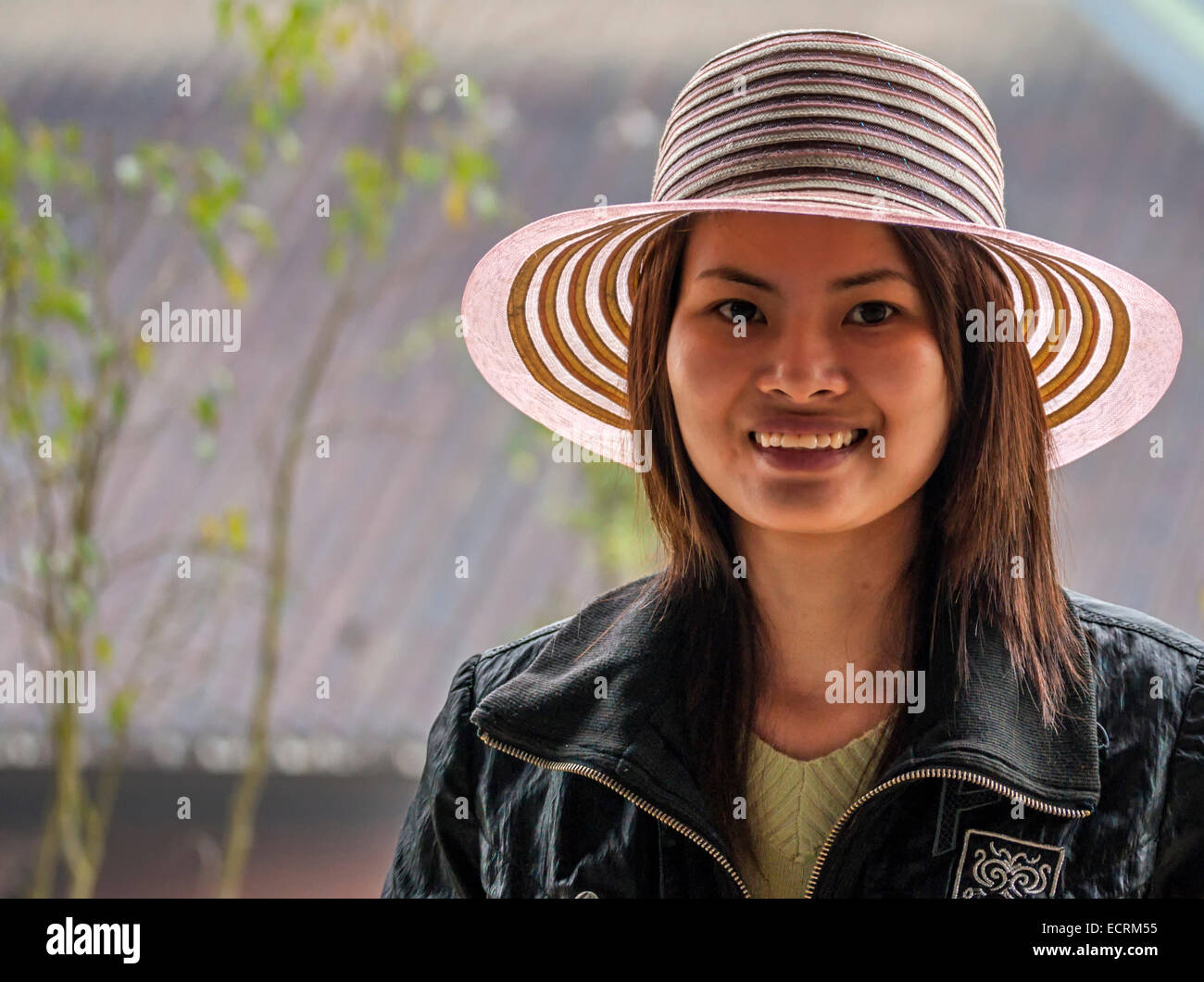 Young Vietnamese woman with fancy hat. Stock Photo