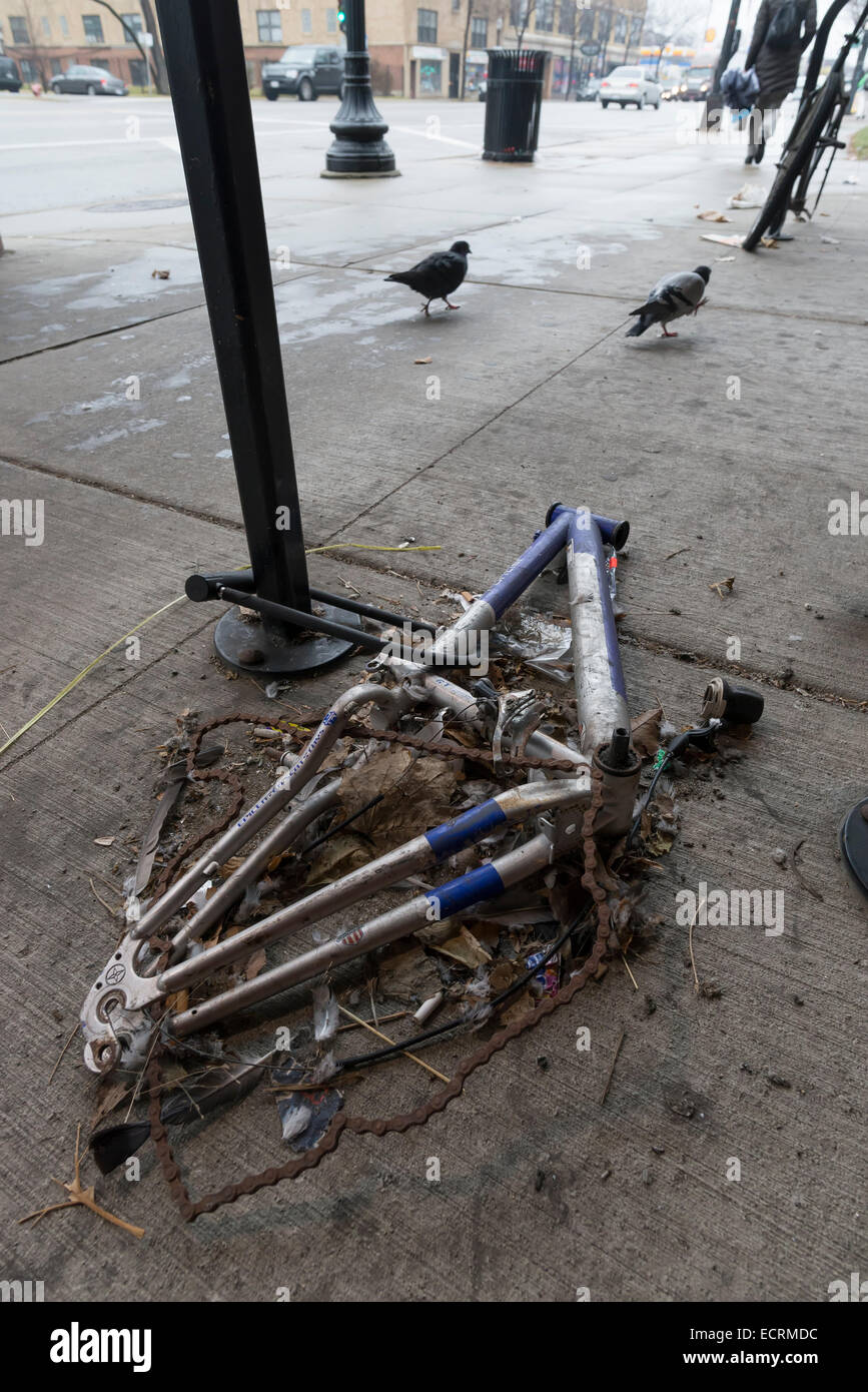 Frame from a vandalized bicycle locked to a bike rack, Chicago Stock