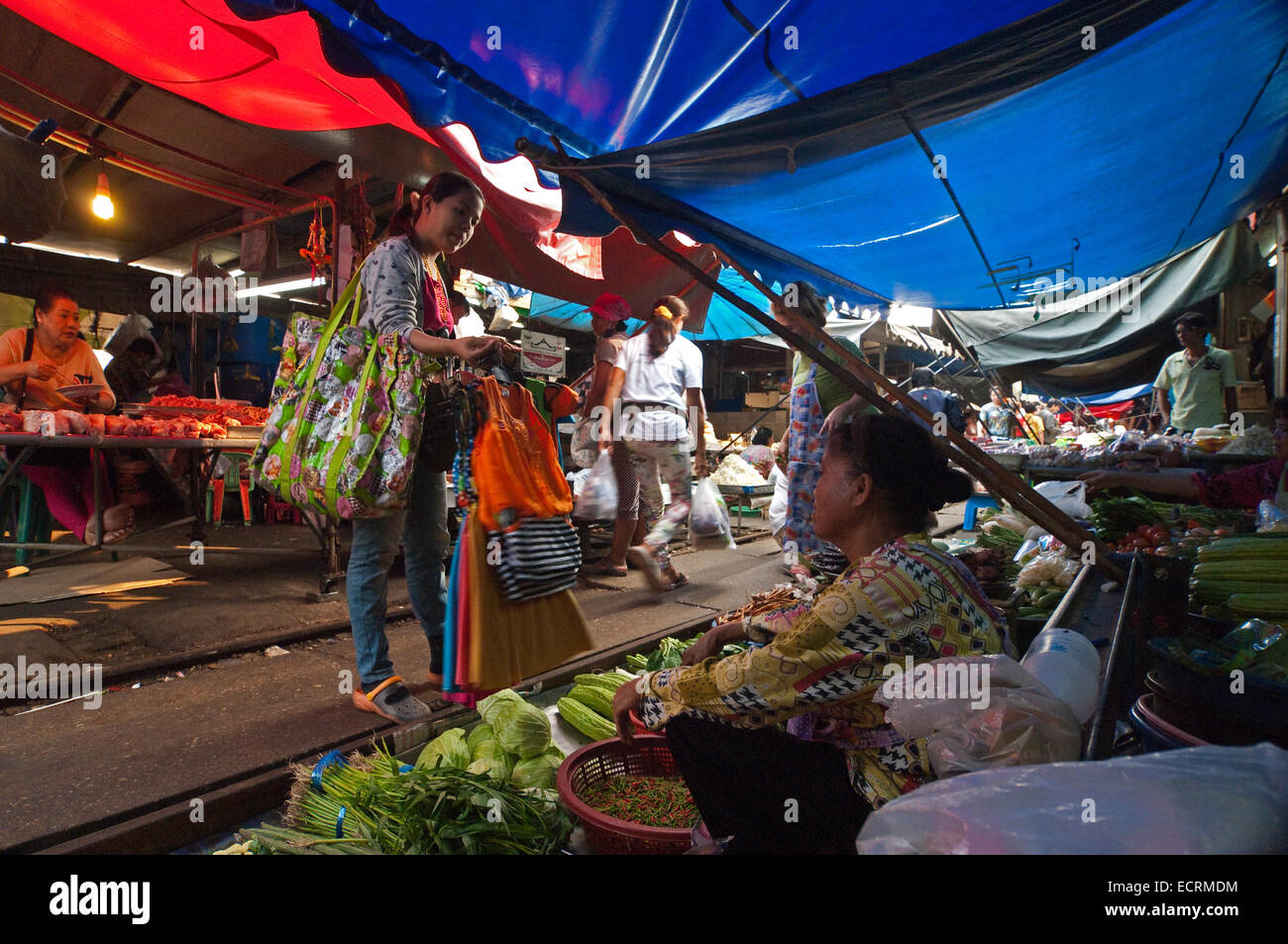 Horizontal view of the marketplace at Maeklong surrounding railway tracks. Stock Photo