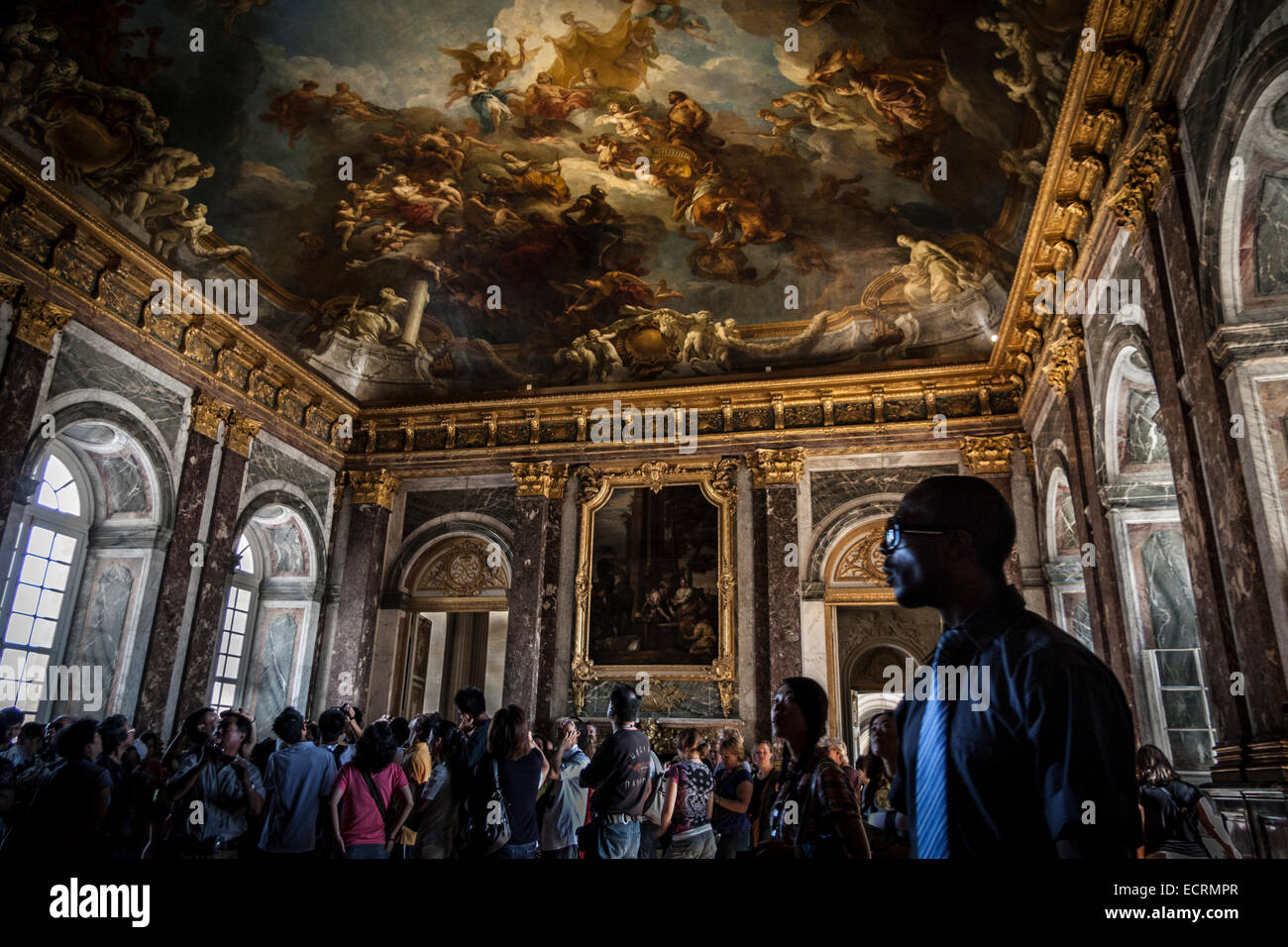 Tourists at Hercules Drawing Room. Palace of Versailles, France Stock Photo