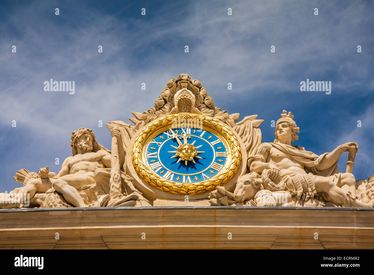 The clock and sculpture of Hercules above the main entrance to the Palace of Versailles, France Stock Photo