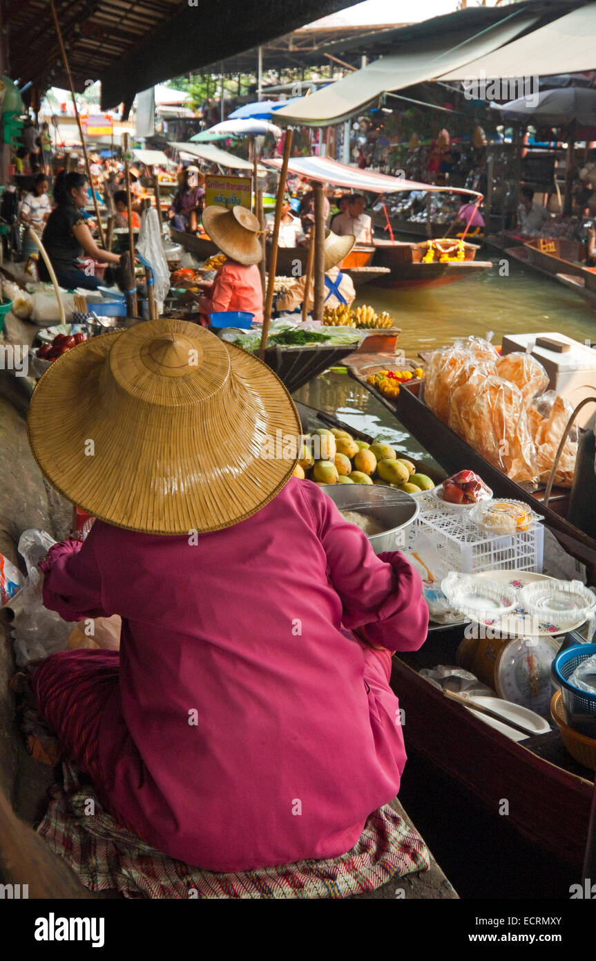 Vertical view of ladies selling produce from their wooden boats at Damnoen Saduak Floating Market in Ratchaburi. Stock Photo