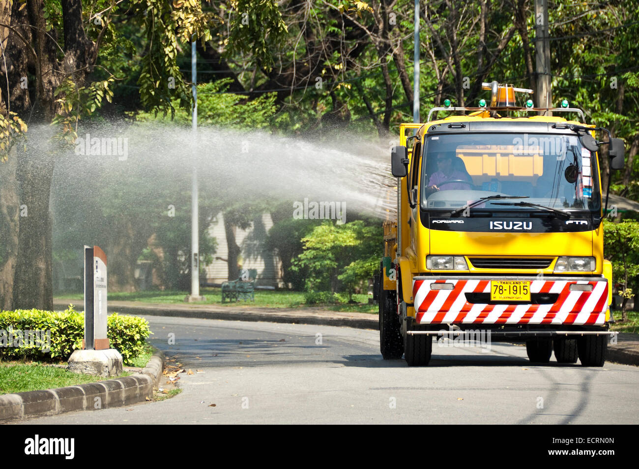 Horizontal view of a truck used to water the plants in Lumphini Park in Bangkok. Stock Photo