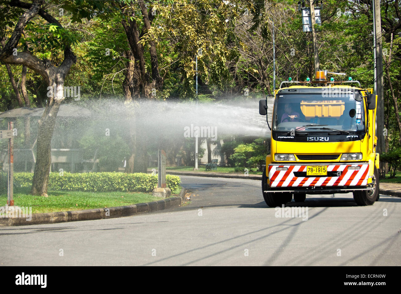 Horizontal view of a truck used to water the plants in Lumphini Park in Bangkok. Stock Photo