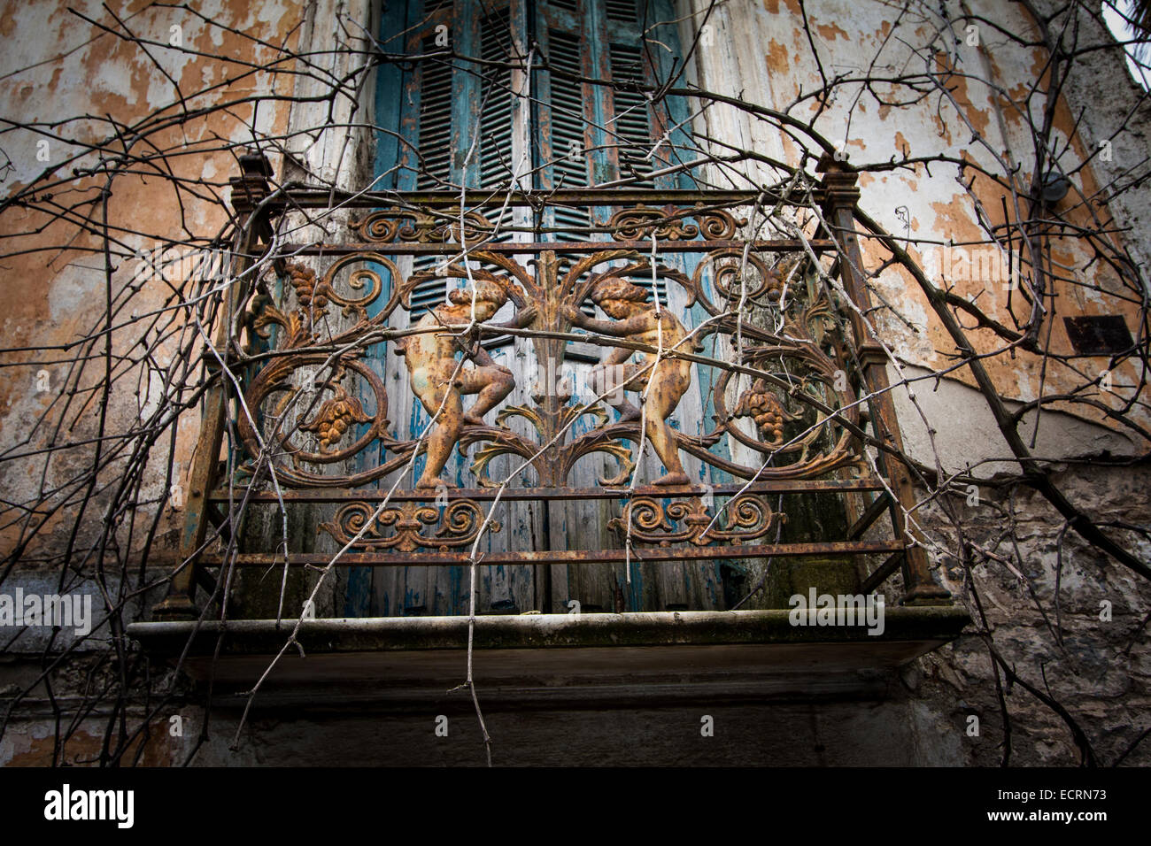 The balcony railing of an abandoned house at Tripoli city. Arcadia, Peloponnese, Greece Stock Photo