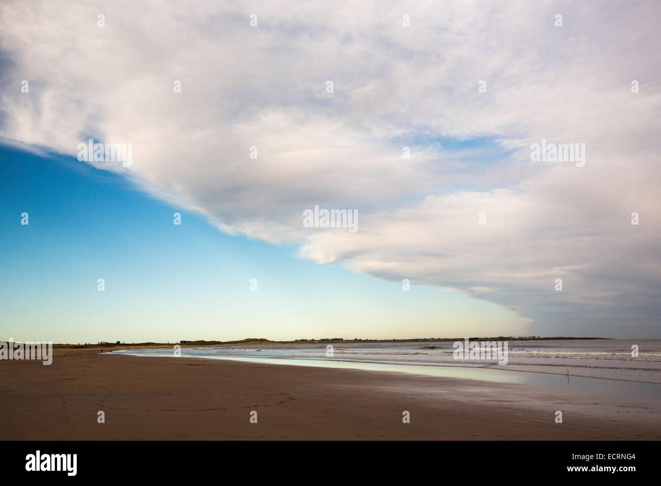 A weather front passing out to sea over Beadnell Beach, Northumberland, UK. Stock Photo