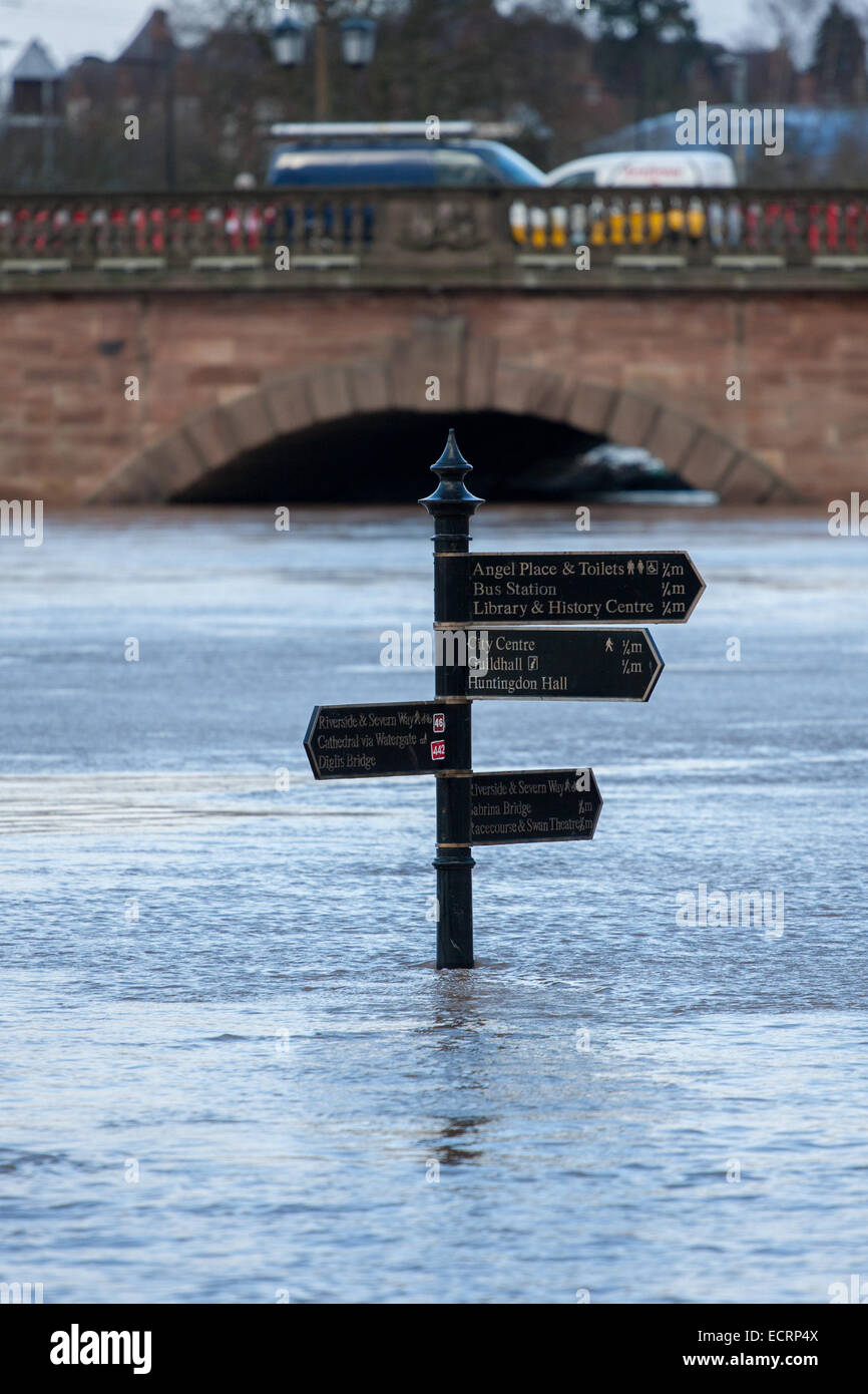 High flood water in Worcester, 2014. Pedestrian sign on footpath alongside the river Severn, with Worcester bridge in background Stock Photo